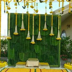 an outdoor stage decorated with yellow and green decorations