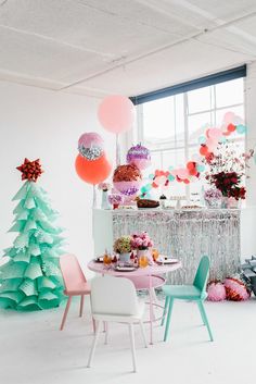 a party with balloons, cake and decorations