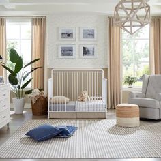 a baby's room is decorated in neutral colors