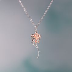 This exquisite rose pendant necklace showcases a 3D rose in 925 sterling silver with rose gold plating for a stunning flower color. It hangs delicately on a 925 sterling silver cable pendant with an adjustable ball. Make this elegant rose pendant necklace a part of your everyday fine jewelry collection, or gift it to a loved one for a special occasion. Materials: 925 sterling silverFinish: platinum plate, rose gold plateMaximum length is 17.5 inches, can be adjusted shorter using the adjustable ball. Jewelry Care: See more information about how to care for your jewelry here. Shipping Policy: Orders will be shipped within 1-3 business days. Economy shipping will take 7-14 days to arrive and standard shipping is 1- 4 days for U.S. orders. International shipping time is depended on the countr Rose Gold Flower Necklace With Round Pendant, Rose Gold Necklace With Flower Pendant And Delicate Chain, Rose Gold Flower Pendant Necklace With Clavicle Chain, Rose Gold Pendant Flower Necklace With Clavicle Chain, Rose Gold Flower Pendant Clavicle Necklace, Rose Gold Flower Pendant Necklace With Delicate Chain, Rose Gold Clavicle Chain Flower Pendant Necklace, Rose Gold Clavicle Chain Necklace With Flower Pendant, Silver Flower Pendant Jewelry With Rose Design