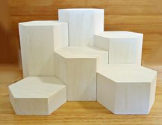 several white cubes are stacked on top of each other in the shape of hexagonal blocks