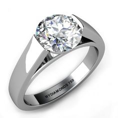 a white gold ring with a single diamond