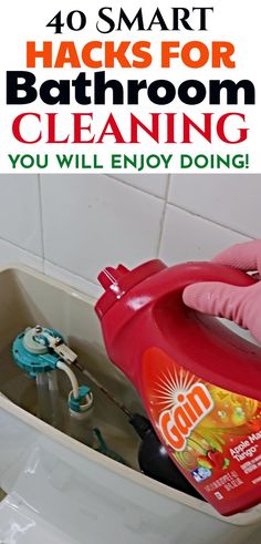 a hand in pink glove holding a bottle of soap over a sink with the words 40 smart hacks for bathroom cleaning you will enjoy doing