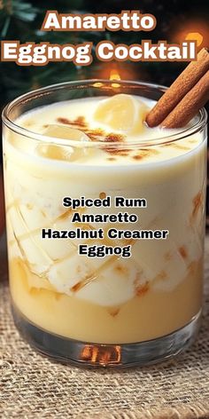 an eggnog cocktail in a small glass with cinnamon sticks on top and the caption reads, spiced rum amaretto hazel creamer