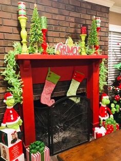 a fireplace decorated for christmas with stockings and stocking