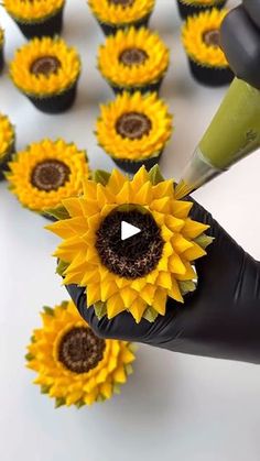 someone is cutting out sunflowers to make them look like they are being cut