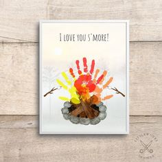 a card with the words i love you's more written on it and hand prints