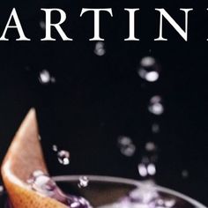 the cover of martini with an orange slice and ice cream on it's rim