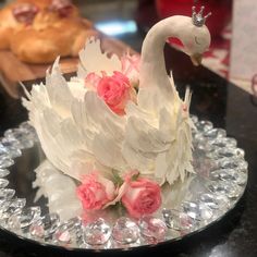 a cake decorated with white frosting and pink flowers