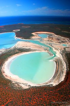 an aerial view of the blue lagoons and coral reefs in australia's great barrier