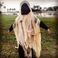 a person in a costume walking across a field