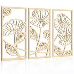 three panels with flowers cut out of them on a white background, each panel has an intricate