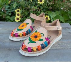 New womens leather sunflower embroidered authentic mexican huarache shoe sandal Casual Summer Clogs With Stitched Sole, Leather Huarache Sandals With Ankle Strap For Spring, Leather Ankle Strap Huarache Sandals For Spring, Summer Multicolor Round Toe Clogs, Spring Flat Heel Clogs With Stitched Sole, Summer Leather Ankle Strap Huaraches, Summer Open Toe Huaraches With Stitched Sole, Summer Huarache Sandals With Leather Footbed And Closed Toe, Spring Huarache Sandals With Leather Sole And Open Toe