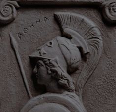 a close up of a carving on the side of a building