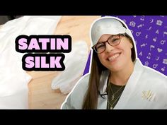 a woman wearing glasses and a white hoodie with the words satin silk on it