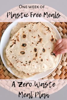 a white plate topped with two flatbreads on top of a wicker basket