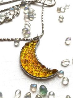 It is handcrafted exclusive design fused glass half moon pendant. Each of our pendants can not be repeated exactly. The pattern of glass is always unique. You will receive a pendant on a chain 20 inches. It will be nice anniversary gift. All jewelry comes in a cardboard box ready to be gift wrapped. We accept only PayPal. Item is ready to ship, we will send it within 1-3 bussines days after payment confirmation. We do not ship on Saturdays and Sundays. We will let you know when your package is o Handmade Celestial Half Moon Necklaces, Handmade Celestial Half Moon Necklace, Handmade Moon-shaped Artistic Jewelry, Celestial Resin Jewelry As Gift, Celestial Resin Jewelry For Gifts, Handmade Artistic Moon-shaped Jewelry, Celestial Resin Jewelry As A Gift, Handmade Moon Shaped Artistic Jewelry, Moon-shaped Necklace With Large Pendant For Gift