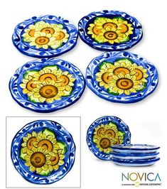 four blue and yellow plates with sunflowers on them