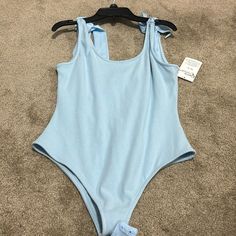 Price Is Negotiable Casual Light Blue One-piece Swimwear, Casual Blue Bodysuit For Swimming, Light Blue Sleeveless Casual Swimwear, Casual Light Blue Sleeveless Swimwear, Blue Stretch Cotton Bodysuit, Casual Blue Bodysuit For Poolside, Sleeveless Light Blue Bodysuit For Vacation, Spring Light Blue Swimming Bodysuit, Casual Light Blue Sleeveless Bodysuit