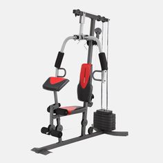 the body - solid home gym system is shown in red and black