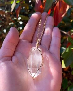 "☾ Large Clear Quartz Necklace ☾ High quality, rough Clear Quartz point in its natural form in a secure & subtle setting that highlights the stone These pendants come in pure copper, 14k gold, or sterling silver. Choose from an adjustable faux leather chord, a matching 18\" copper chain, a matching 18\" sterling silver chain, a matching 14k gold chain or get just the pendant. ⭐️Faux Leather Chord Options: Choose from black, dark brown or tan. These chords are also tied to be adjustable so you ca Spiritual Clear Quartz Crystal Necklace, Spiritual Clear Crystal Pendant Necklace, Spiritual Rose Gold Pendant Crystal Necklace, Spiritual Clear Crystal Necklace For Healing, Spiritual Clear Jewelry For Healing, Spiritual Quartz Crystal Necklace Hand Wrapped, Clear Quartz Necklace, Wire Wrap Jewelry Designs, Clear Quartz Point