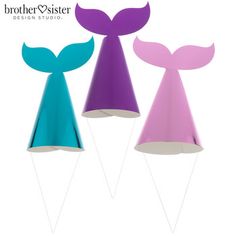 three different colored paper hats with tails