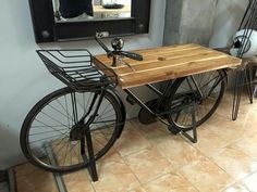 a bicycle with a wooden table on it