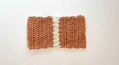 two pieces of crochet are shown on a white surface, one is orange and the other is brown