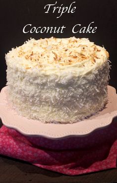 a triple coconut cake sitting on top of a white plate with the words triple coconut cake above it