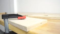 a piece of wood with a tool on top of it