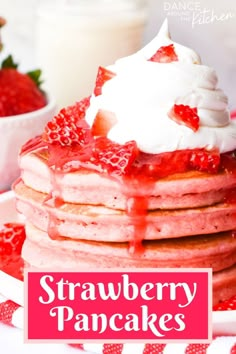 strawberry pancakes with whipped cream and strawberries on top