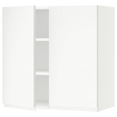 a white cabinet with two doors and shelves on the bottom, one door open to reveal an empty shelf