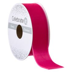 a roll of pink satin ribbon with dots on the edge and an adhesive tape