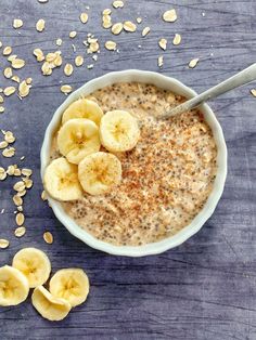 a bowl filled with oatmeal and sliced bananas