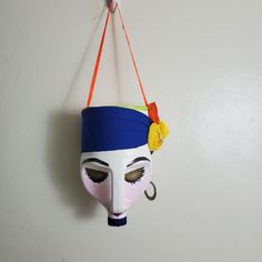 a colorful mask hanging on the wall