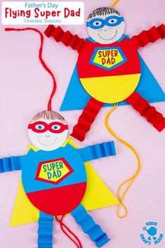 two paper puppets made to look like superheros with the words flying super dad on them