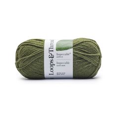 green yarn ball with white label on top and the words, loomse thread