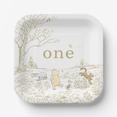 a white plate with winnie the pooh and tigger on it that says, one