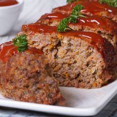 meatloaf with sauce and rice on a plate