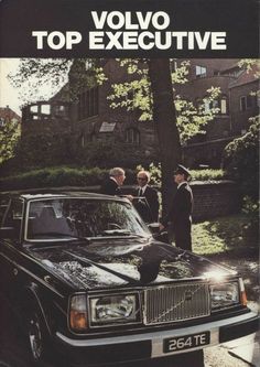 an advertisement for volvo's executive car, which is parked on the side of a street