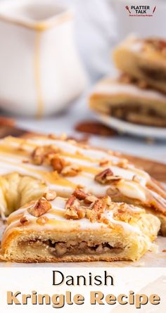 danish kringle recipe with white icing and pecans on the table next to it