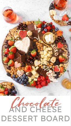 chocolate and cheese dessert board on a marble table with fruit, nuts, crackers, and wine glasses