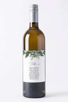 a bottle of white wine with an olive label