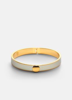 a white and gold bang bracelet