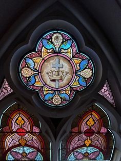 an ornate stained glass window in a church