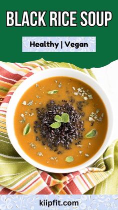 a bowl of black rice soup on top of a table