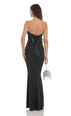 Back Bow Strapless Maxi Dress in Black | LUCY IN THE SKY Formal Black Backless Dress With Tie Back, Black Backless Formal Dress With Tie Back, Black Backless Dress With Tie Back For Formal Occasions, Black Tie Back Evening Dress For Formal Occasions, Backless Maxi Dress For Black-tie Events, Sleeveless Maxi Dress With Bow Tie Back For Evening, Evening Dress With Bow Tie Back, Formal Backless Dress With Bow Tie Back, Black Dresses With Bow Tie Back For Date Night