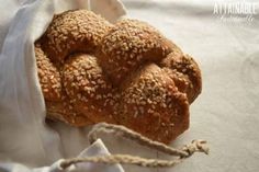 a bagel with sesame seeds in it sitting on top of a cloth