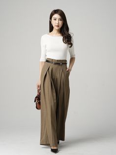 "Chic and polished, these brown palazzo pants features a tailored wide leg silhouette, finished with invisible buckle and zipper closure front , two pockets in the side, and a comfortable fabric. The wide leg long pants are perfected for a day of running errands but with some added fun and flirty street style. The women pants is designed with pleating details and pockets make it fashion and useful. DETAIL * 99% polyester * Invisible buckle and zipper closure * Pockets each side * All season pant Khaki Wide Leg Cargo Pants, Straight Brown Pants For Office, Brown Straight Pants For Office, Khaki Wide Leg Dress Pants For Work, Office Brown Trousers, Brown Wide Leg Dress Pants For Fall, Beige Wide Leg Pants For Office, Beige Wide Leg Office Pants, Elegant Khaki Wide Leg Dress Pants