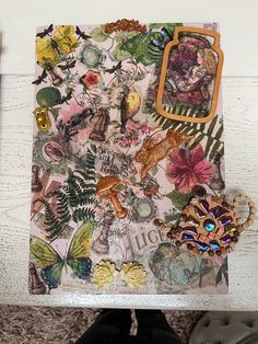 an altered collage with flowers, leaves and other things on it's side